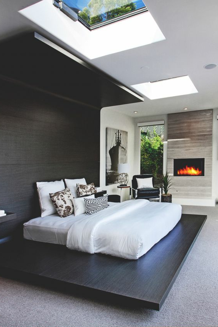 casa-minimalista-dormitorio-pared-de-madera-techo-con-ventanas-diseño-moderno
