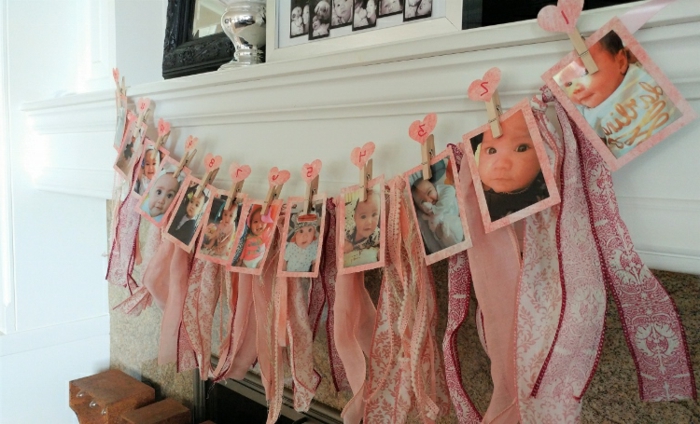 decoracion fiestas, decoracion en rosado con fotos de bebe en chimenea