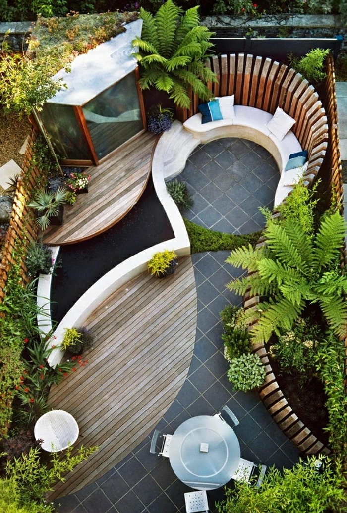 casas con jardin, propuesta super moderna para organizar tu patio moderno, líneas ovales, suelo nivelado, sitio para sentar con cojines decorativos