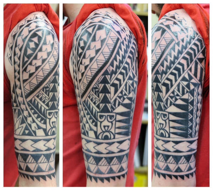 tatuajes antebrazo, brazo entero tatuado, tatuaje polinesio, punta e lanza, dientes de tiburón, blusa roja