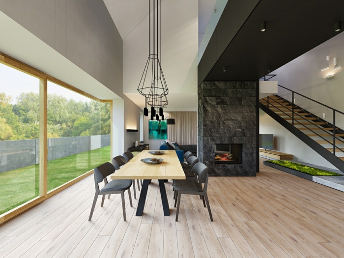 salon comedor, espacioso comedor en estilo minimalista, chimenea acogedora, mesa de madera y sillas en gris, grandes ventanales con vista al jardín