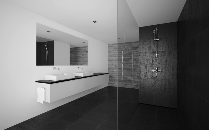 baños pequeños con ducha, baño en blanco y negro, espejo grande , lavabo doble, ducha de obra con pared de granito negro. mampara de vidrio