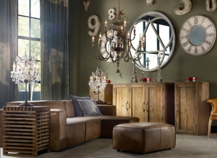 salones vintage, salon en tonos oscuros, sofá tapizada de piel en marrón, armarios de madera, grande espejo vintage