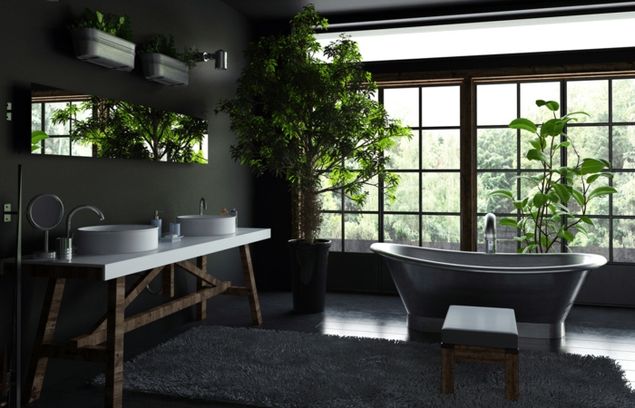 preciosa propuesta de baño decorado con plantas verdes y toque rústico, alfombra blanca peluda, muebles de madera y grandes ventanales 
