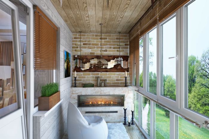 ejemplo de pequeño balcón decorado de estilo moderno, decorar terrazas con estilo, suelo de madera y pared de ladrillo 