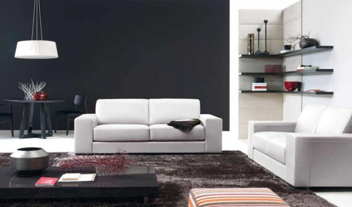 que colores se llevan para pintar un salon, decoración moderna con pared en negro y muebles blancos, alfombra peluda