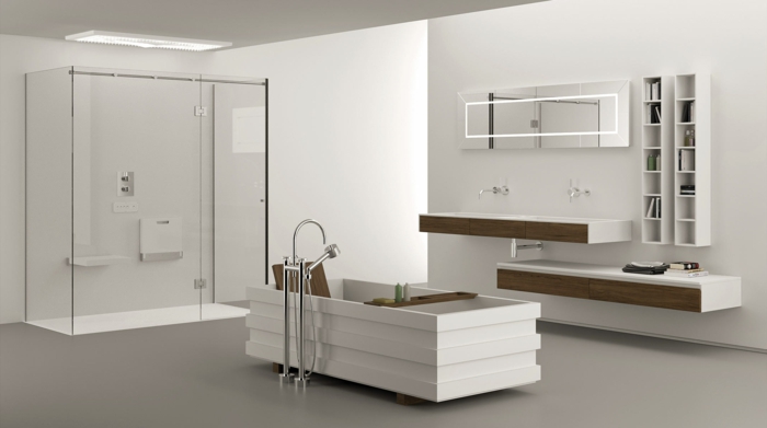 baño blanco original, armarios de baño, ducha con plato y mámpara de vidrio, bañera rectangular diseño moderno, estanterías de madera, suelo con baldosas gris