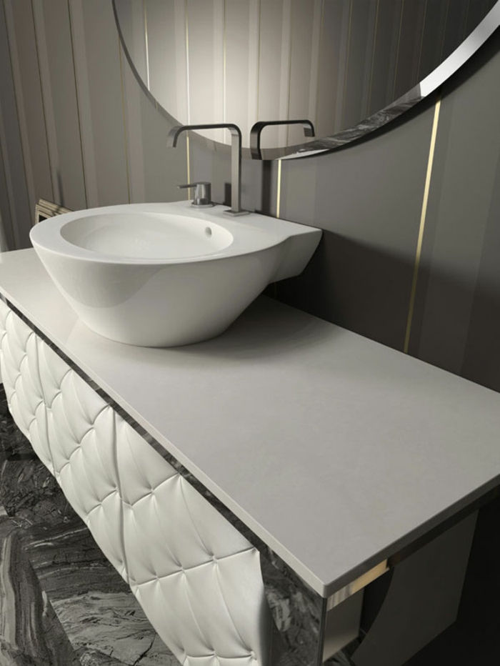 mueble lavabo moderno tapizado en capitoné blanco, muebles de baño modernos detalle, lavabo pequeño, espejo redondo