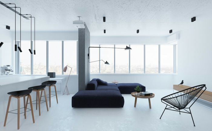 precioso interior en blanco con sofá en negro y paredes y suelo en blanco, decoracion salon moderno con lámparas modernas y originales 