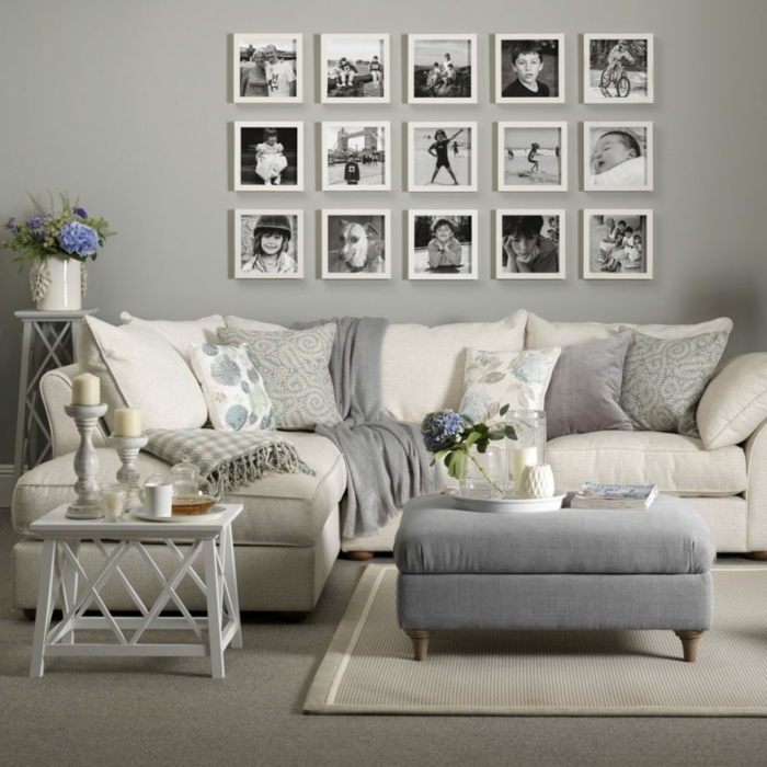 salon en colores neutros, gris y beige, ideas para espacios pequeños, paredes grises, decoración con fotografías en blanco y negro, sofá con cojines, moqueta y tapete