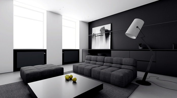 salón minimalista decorado en negro y blanco, muebles de salon modernos de diseño en capitoné y color gris oscuro