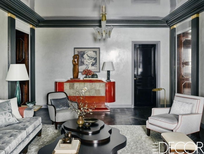 espacio decorado en estilo vintage minimalista, muebles de salon modernos en capitoné, paredes en blanco y gris