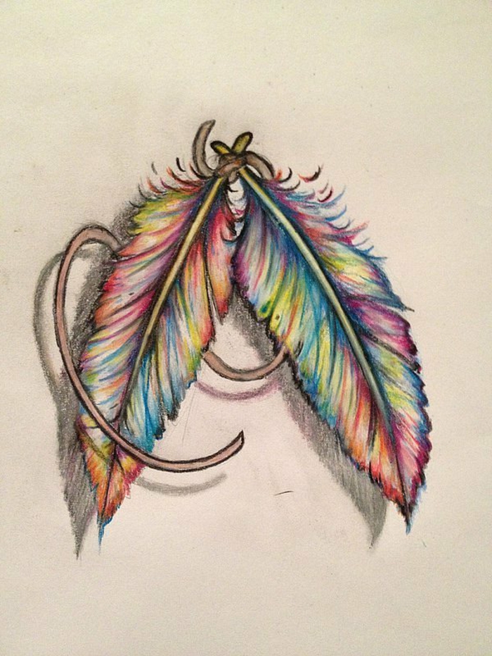 preciosas ideas diseños de tatuajes con plumas, dos plumas pintados en papel en colores del arco iris 