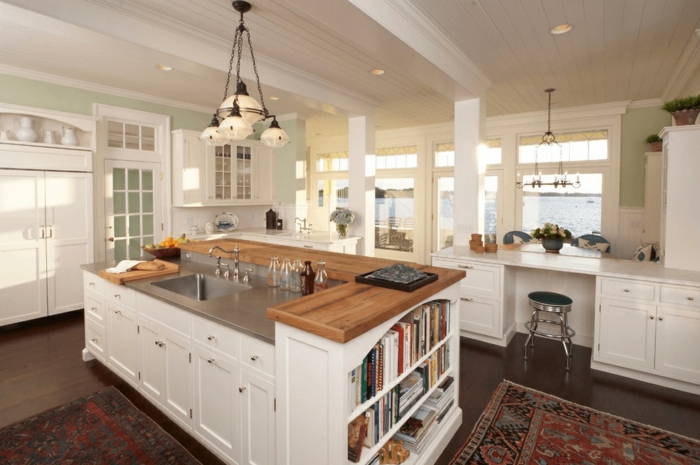 diseño de cocinas modernas con islas originales, lámpara y alfombra vintage y decoración en blanco 