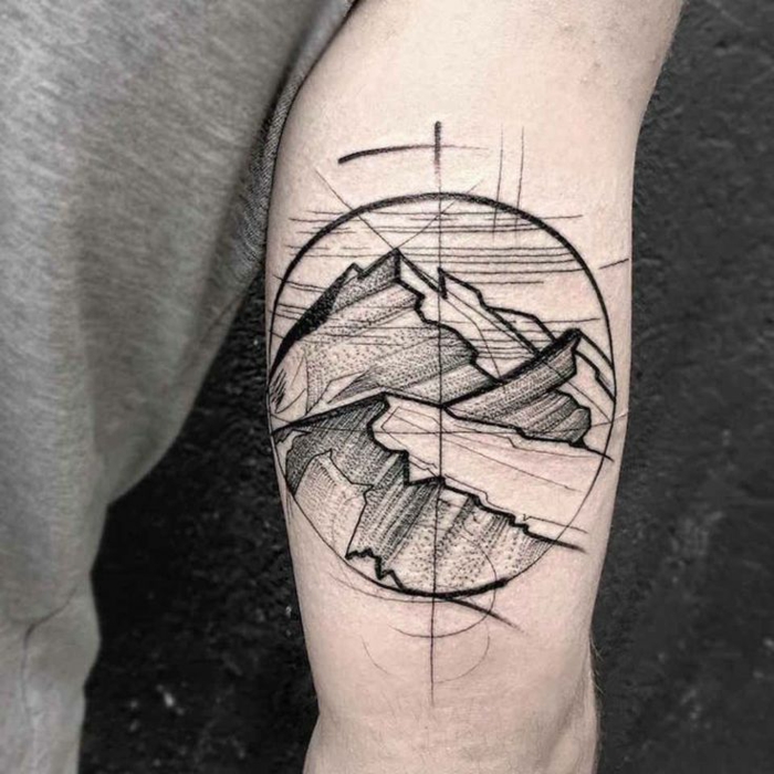 diseños de tatuajes para hombres con significado, dibujo de montañas en un círculo, ideas para tatuajes 2018 