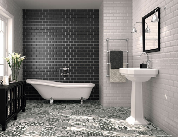 baños blanco y negro de diseño, paredes con azulejos en blanco y negro que imitan ladrillos y suelo con azulejos ornamentados blanco y gris 
