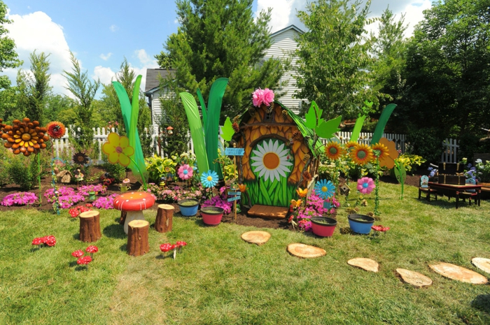 decoracion de jardines rústicos, jardín para niños, mi tierra Disney con sillas de troncos y mesa seta