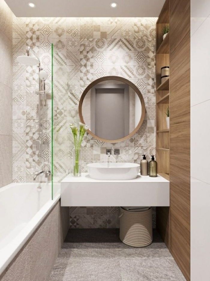 azulejos baños porcelanosa, baldosas de suelo en gris con motivos más claros y oscuros, espejo redondo