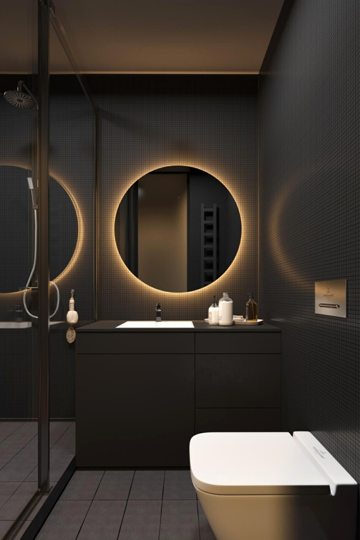 decoracion baños en estilo moderno, cuarto de baño decorado en tonos oscuros, espejo oval moderno 