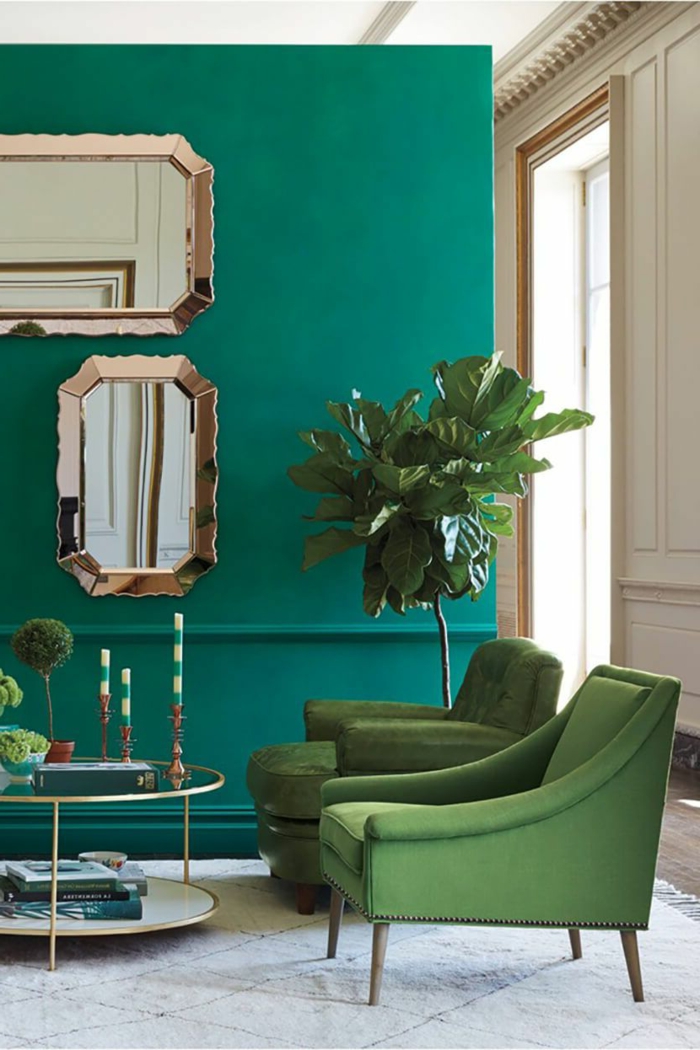 decoracion pisos pequeños, paredes en verde con sillones en verde y con una plata grande al lado