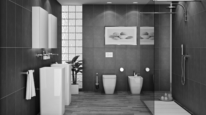 grande baño decorado en gris oscuro y blanco con cuadros decorativos en la pared y suelo de azulejos 