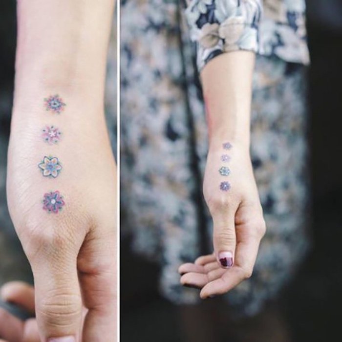 ideas de tatuajes en la mano con motivos florales, tatuajes pequeños y bonitos en colores pastel 