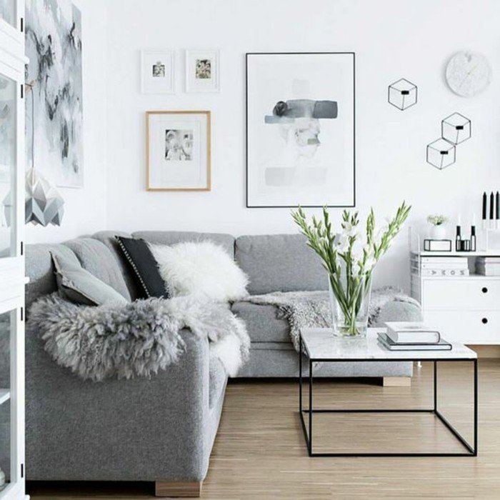 preciosa decoracion de salones grises decorados en estilo escandinavo, cuadros en la pared 