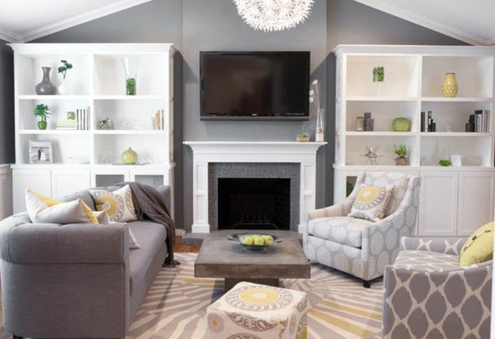 salón moderno con paredes grises, estanterias blancas y muebles de diseño en blanco y muebles modernos 