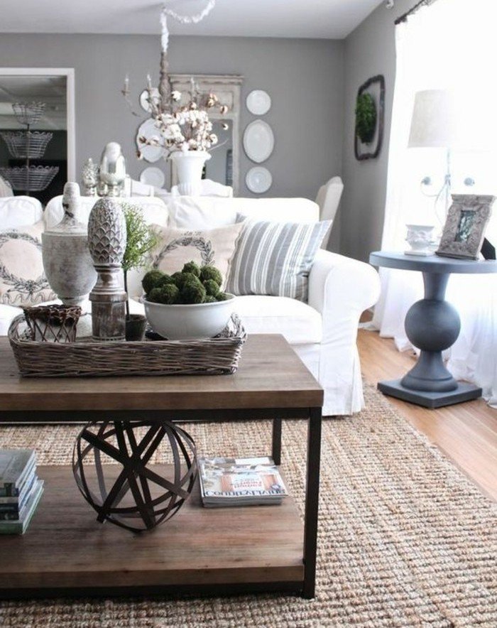 salón en estilo vintage con paredes grises, sofá en color blanco y mesa de madera 