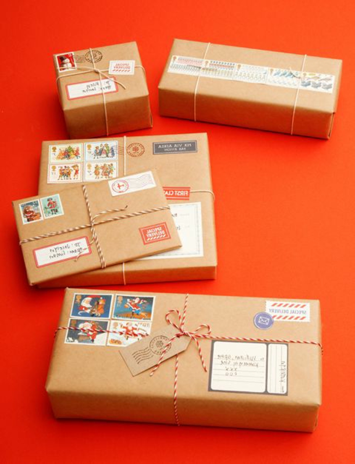 ingeniosas propuestas sobre como envolver un regalo de forma creativa, cajas de regalos con papel embalaje con marcas y sellos 