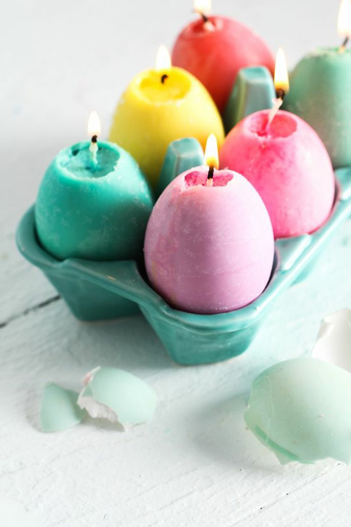 ideas de manualidades para Pascua, huevos coloridos hechos de velas hechas a mano en casa 