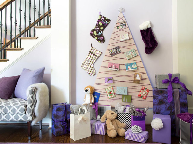 cuáles son las últimas tendencias en decoración navideña, como adornar un arbol de navidad alternativo, árbol navideño de cartón