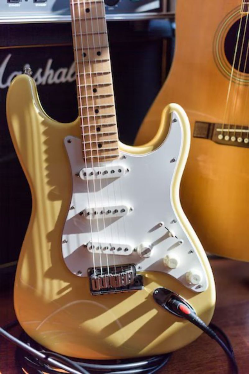 px imagen de una guitarra en color amarillo